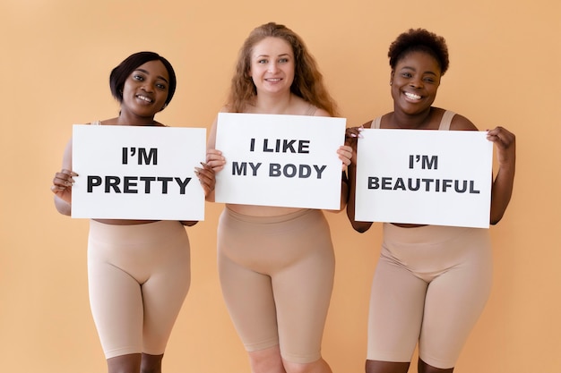 front-view-three-women-holding-placards-with-body-positivity-statements_23-2148956672.jpg