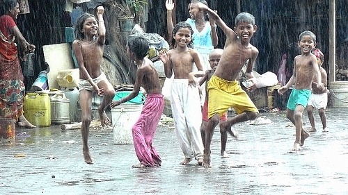happy-children-dancing-in-the-rain.jpg