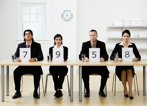 sb10064401w-001-four-business-people-sitting-at-desk-gettyimages.jpg