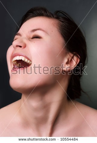 stock-photo-close-up-of-girl-s-ecstatic-face-on-dark-background-10554484.jpg